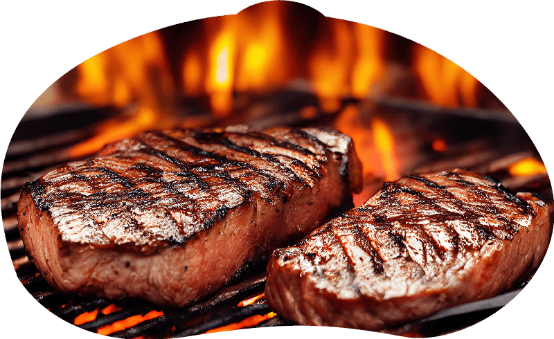 two steaks cooking on a grill with flames in the background and a fork in the foreground of the picture. . two steaks cooking on a grill with flames in the background and a fork in the foreground of the picture. .